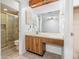 Bathroom boasts a glass shower, vanity with sink, and ample lighting at 2003 Bentwood Dr, Winter Park, FL 32792