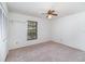 Bedroom featuring neutral carpet, a window with blinds, and a ceiling fan at 2003 Bentwood Dr, Winter Park, FL 32792