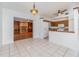 Open-concept dining area adjacent to kitchen and living area with access to a fireplace at 2003 Bentwood Dr, Winter Park, FL 32792