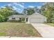 Charming single-story home with a well-maintained lawn and an attached two-car garage at 2003 Bentwood Dr, Winter Park, FL 32792