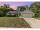 Charming single-story home with a well-maintained lawn and an attached two-car garage at 2003 Bentwood Dr, Winter Park, FL 32792