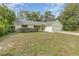 Single-story home with well-maintained landscaping and a two-car garage at 2003 Bentwood Dr, Winter Park, FL 32792