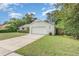 Single-story home with a well-maintained lawn and a two-car garage at 2003 Bentwood Dr, Winter Park, FL 32792