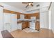 Functional kitchen with wood cabinets and white appliances at 2003 Bentwood Dr, Winter Park, FL 32792