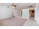 Open-concept living area with carpet, adjacent to the kitchen at 2003 Bentwood Dr, Winter Park, FL 32792