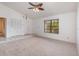 Inviting living room with tile entry, neutral carpet, and a window letting in natural light at 2003 Bentwood Dr, Winter Park, FL 32792