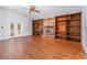 Cozy living room with fireplace, built-in shelving and wood-look floors at 2003 Bentwood Dr, Winter Park, FL 32792