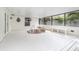 Enclosed patio features a hot tub, ample seating, and a screened enclosure at 2003 Bentwood Dr, Winter Park, FL 32792