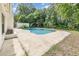 Backyard oasis showcases a refreshing in-ground pool and a private setting at 2003 Bentwood Dr, Winter Park, FL 32792