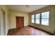 Bedroom has hardwood floors, natural light, yellow walls, and a closet at 206 N Highland Ave, Winter Garden, FL 34787