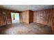Wood-paneled room features hardwood floors, natural light, storage, and paneled walls at 206 N Highland Ave, Winter Garden, FL 34787