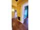 Hallway with hardwood floors connecting to various rooms in the home, offering seamless transition at 206 N Highland Ave, Winter Garden, FL 34787