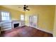 Cozy living room with hardwood floors, fireplace, built-in shelving and abundant natural light at 206 N Highland Ave, Winter Garden, FL 34787