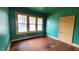Inviting living room with hardwood floors, natural light and painted in green and yellow at 206 N Highland Ave, Winter Garden, FL 34787