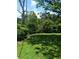 A large backyard features a well-maintained lawn with ample space for outdoor activities and relaxation at 2103 Mantilla Ave, Orlando, FL 32811