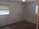 Bedroom featuring carpeted flooring and a window allowing natural light at 2103 Mantilla Ave, Orlando, FL 32811