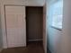 Bedroom closet with double doors and a wire shelf for storage at 2103 Mantilla Ave, Orlando, FL 32811