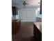 Kitchen featuring dark cabinets, a double-basin sink, and a view to a large double-door pantry at 2103 Mantilla Ave, Orlando, FL 32811