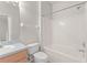 Functional bathroom with shower-tub combo and wood vanity at 214 Monroe Cir, Davenport, FL 33896