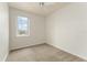 Well-lit bedroom with neutral carpet and a window view at 214 Monroe Cir, Davenport, FL 33896