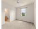 Bedroom with carpet, window, ceiling fan, and attached bathroom at 214 Monroe Cir, Davenport, FL 33896