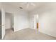 Bedroom features carpeted floors, ceiling fan, and access to bathroom and closet at 214 Monroe Cir, Davenport, FL 33896