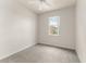 Bright bedroom featuring neutral walls, ceiling fan, and window offering natural light at 214 Monroe Cir, Davenport, FL 33896