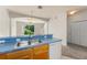 Functional kitchen with breakfast bar, full appliances and an open view to the living room at 214 Monroe Cir, Davenport, FL 33896