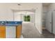 Functional kitchen with breakfast bar and white appliances offer plenty of space and an open floor plan at 214 Monroe Cir, Davenport, FL 33896