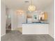 Open living room with neutral paint, carpet floors, and chandelier at 214 Monroe Cir, Davenport, FL 33896