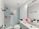 Bathroom featuring modern fixtures, a glass-enclosed shower, and a concrete sink at 225 Lewfield Cir # 225, Winter Park, FL 32792