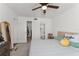 Bedroom featuring a ceiling fan, closet and bathroom access at 225 Lewfield Cir # 225, Winter Park, FL 32792