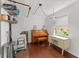 Multi-purpose room with laminate floors, a piano, and a laundry area offers versatility and functionality at 225 Lewfield Cir # 225, Winter Park, FL 32792