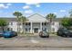 The property boasts a well-maintained exterior with a light gray brick facade and lush landscaping at 225 Lewfield Cir # 225, Winter Park, FL 32792