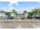 Apartment building with white columns and landscaping in front at 225 Lewfield Cir # 225, Winter Park, FL 32792