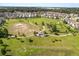Aerial view of a community park with walking paths, green spaces, and recreational areas at 2340 Standing Rock Cir, Oakland, FL 34787