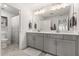 Bathroom featuring a dual vanity with storage space and modern fixtures at 2340 Standing Rock Cir, Oakland, FL 34787