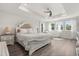 Bright bedroom with large windows, natural light, and a comfortable sitting area at 2340 Standing Rock Cir, Oakland, FL 34787