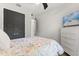 Bedroom features a white dresser, television, and ceiling fan at 2340 Standing Rock Cir, Oakland, FL 34787