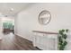 Bright hallway with hardwood floors and stylish console table, creating a welcoming entrance at 2340 Standing Rock Cir, Oakland, FL 34787