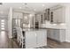 Gourmet kitchen with stainless steel appliances, granite counters, and custom cabinetry at 2340 Standing Rock Cir, Oakland, FL 34787
