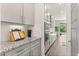 Modern kitchen features stainless steel appliances and granite countertops at 2340 Standing Rock Cir, Oakland, FL 34787