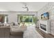 Bright living area with cozy furniture, stylish decor, and a view of the backyard at 2340 Standing Rock Cir, Oakland, FL 34787