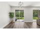 Bright living room featuring hardwood floors, and sliding glass doors leading to an outdoor space at 2340 Standing Rock Cir, Oakland, FL 34787
