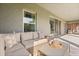 Inviting covered patio with a cozy seating area, ideal for entertaining or relaxation at 2340 Standing Rock Cir, Oakland, FL 34787