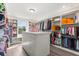 Spacious walk-in closet featuring custom shelving, an island, and ample storage space at 2340 Standing Rock Cir, Oakland, FL 34787