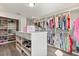 Spacious walk-in closet with custom shelving and clothing racks, offering ample storage at 2340 Standing Rock Cir, Oakland, FL 34787