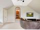 Upstairs bonus room with hardwood floors, tv and ample seating at 2357 Alaqua Dr, Longwood, FL 32779