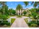 Beautiful home showcasing a circular driveway and manicured landscaping at 2357 Alaqua Dr, Longwood, FL 32779