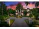 Stately home boasts a circular driveway, lush landscaping, and timeless architectural details at 2357 Alaqua Dr, Longwood, FL 32779